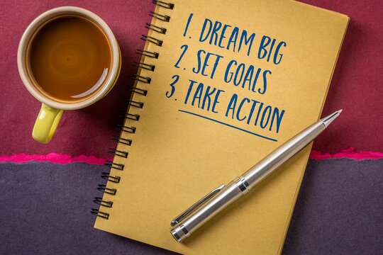 Dream Big. Set Goals. Take Action. &ndash; inspirational handwritten message in a spiral sketchbook with coffee and pen, encouraging vision, planning, productivity, and success.