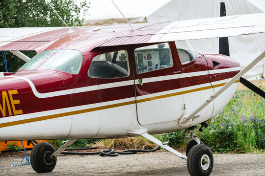 Corby, United Kingdom &ndash; July 1, 2026: Light aircraft parked beside hangar at a small airfield, editorial