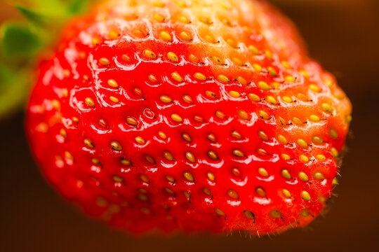 Macro close up of fresh ripe strawberry with seeds