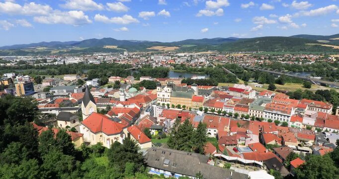 4k locked down stationary motion high angle panoramic view of the city of Trencin, view taken from the Trencin Castle with Peace Square in foreground which is the historic heart of the city, Trencin