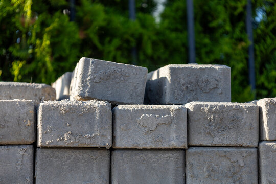 Concrete blocks are stacked neatly at a site for building