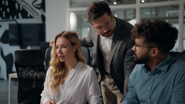 Three multiethnic confused business colleagues discuss computer error difficulty work fail talking Caucasian businesswoman holding head tired cooperate with Arabian businessmen group team managers