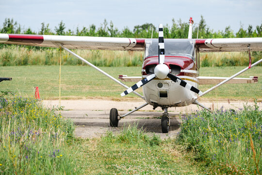 Corby, United Kingdom &ndash; July 1, 2026: Light aircraft parked beside hangar at a small airfield, editorial