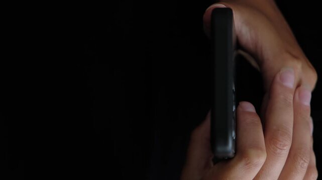 Social media addiction, compulsive scrolling and smartphone overuse, close up of woman holding mobile phone with copy space for text, dark background, digital lifestyle concept