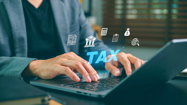Online tax payment concept, accounting and finance with digital icons above laptop