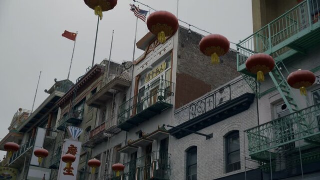 Chinatown Building Facades Red Lanterns With Both Chinese And American Flag Flying, Low Angle