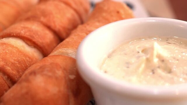 Close-up of Traditional Venezuelan Tequenos with Dipping Sauce