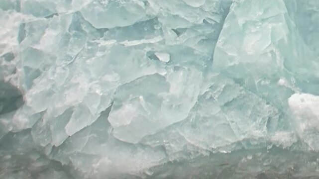 An extreme polar journey reveals the mesmerizing patterns of fractured blue and white ice covering the vast Arctic Ocean. Witness nature's chilling, formidable beauty on this frozen expanse.