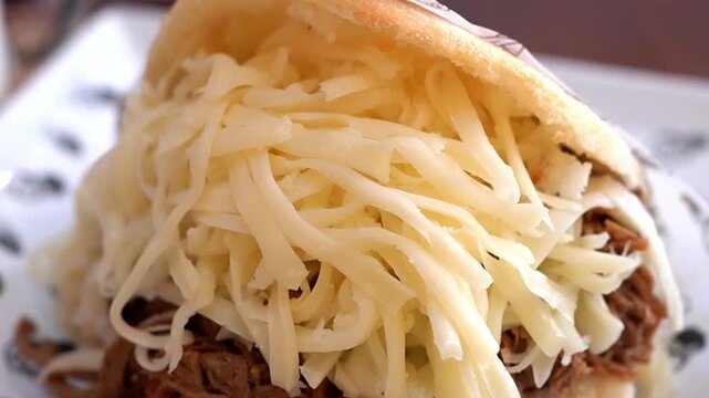 Delicious Arepa Pelua with Oozing Cheese and Meat, Popular Latin American Street Food