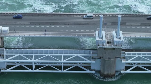 Aerial view of the Eastern Scheldt storm surge barrier with traffic, a marvel of Dutch coastal engineering
