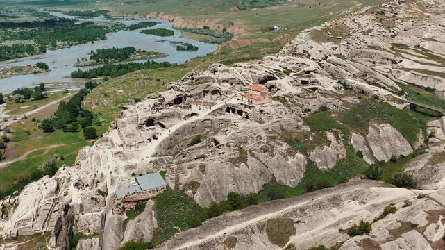 Cinematic footage of Uplistsikhe, one of Georgia's oldest rock-hewn settlements. Ancient caves, carved stone architecture, panoramic landscapes