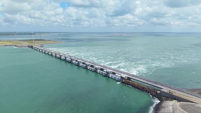 Dutch engineering marvel of the Eastern Scheldt storm surge barrier with renewable energy wind turbines in Zeeland