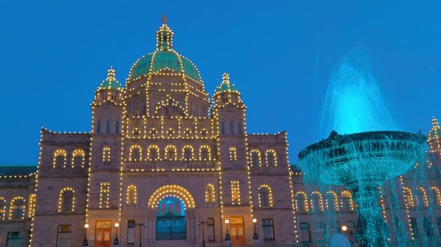 Victoria, BC, Canada &ndash; July 2, 2026: Illuminated British Columbia Parliament Buildings and fountain at night