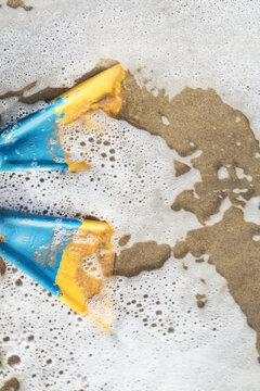 Blue and Yellow Swim Fins in the Water