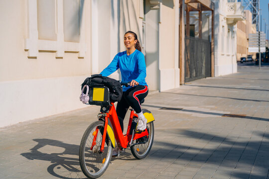 A woman rides a bicycle