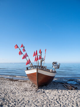 Historic Fishing Vessel Resting on Beach in Binz