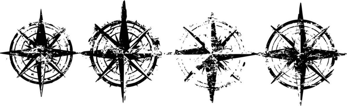 Set of four vintage compass roses in black ink with distressed and grunge texture isolated on white