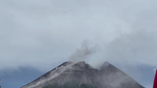 Dramatic morning eruption of Mount Merapi volcano with volcanic