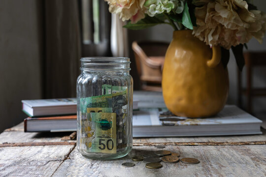 Australian 50 dollar cash money in a jar at home