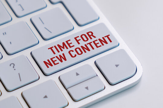 Red text TIME FOR NEW CONTENT sits on a keyboard