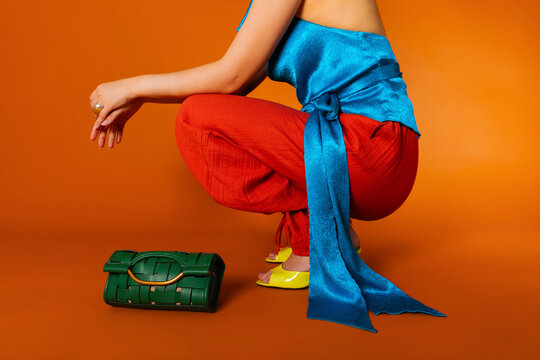 Woman showing modern fashion color block outfit 
