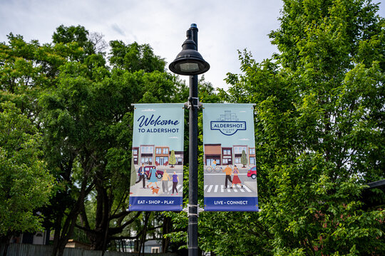 Welcome to Aldershot Village banners in Burlington. Burlington, Canada - June 29, 2026.