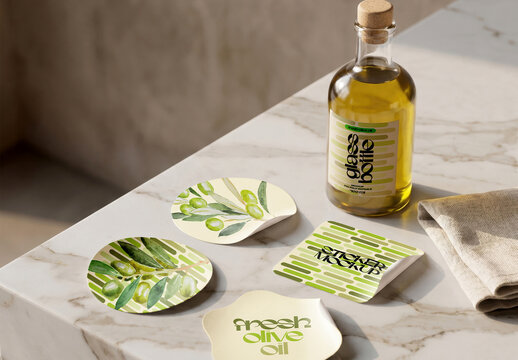 Sticker Label Set and Glass Bottle Mockup on Marble