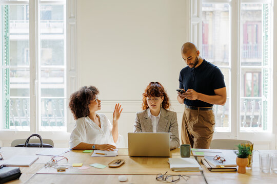 Collaborative diverse team working in bright office