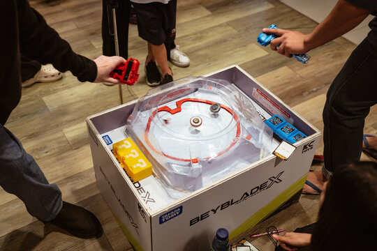 Bangkok, Thailand - November 22, 2025 : People playing Beyblade X, a battling spinning top, in a weekly competition event at a shopping mall.