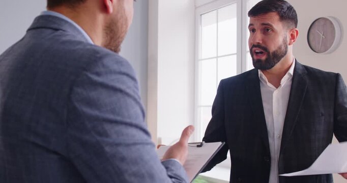 Angry business people in team arguing during office meeting, shouting and working through conflict in a tense setting with challenges and emotional intensity every day of collaboration.