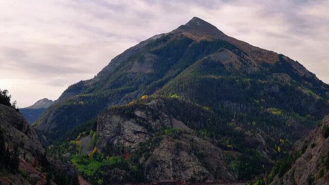 Aerial view of Mount Abram along Million Dollar Highway in San Juan Mountains Colorado fall landscapes with fall foliage trees in autumn season during morning light -  4K Drone