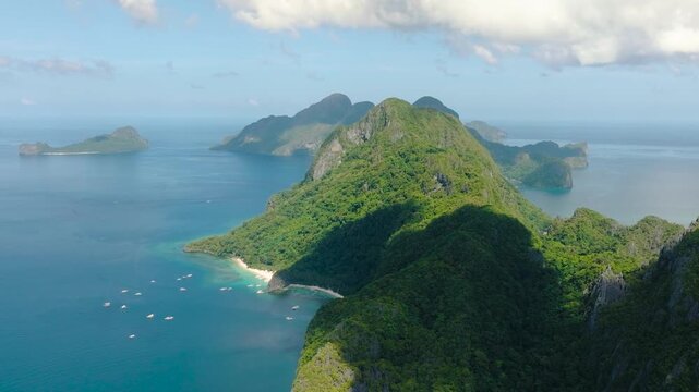 Boats running in Seven Commandos Beach. El Nido, Palawan. Philippines.