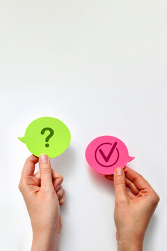 Hands Holding Question and Check Mark Speech Bubbles Decision Concept
