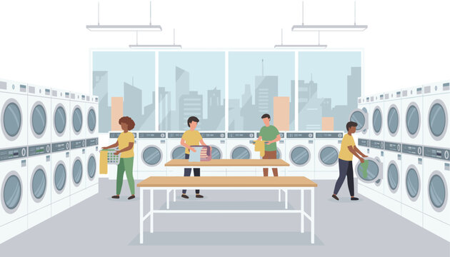 Busy public laundromat with people washing, drying, and folding their clean clothes at wooden tables.