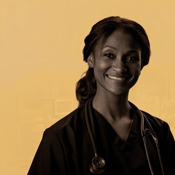 Portrait of a smiling female healthcare wearing a black scrub and a stethoscope around her neck nurse