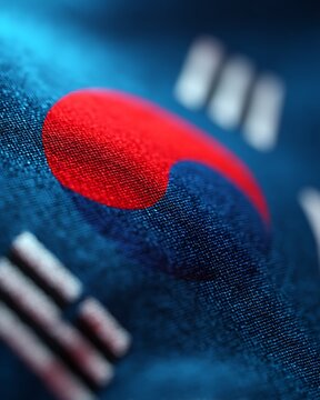 Close-up of the South Korean flag fabric showing the Taegeuk symbol and trigrams with detailed texture and vibrant colors.