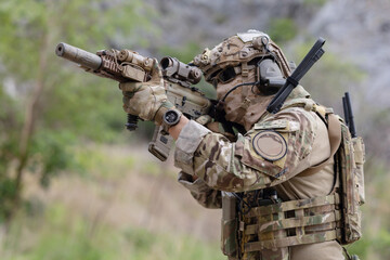 Fototapeta premium Military participate in a patrol in a rocky terrain