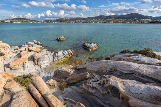 Unique rock formations by the Aegean sea at the Kolymbithres Beach on Paros island in Greece on a sunny day.