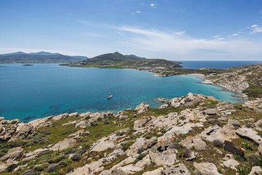View of the rocky, lush and hilly Paros Park and the Aegean Sea on Paros island in Greece viewed from above on a sunny day.