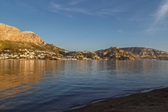 Beautiful and mountainous Kalymnos island by the Aegean Sea in Greece viewed from Telendos island on a sunny afternoon.
