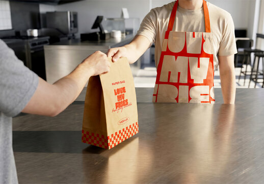 Paper Bag Mockup Handed at Restaurant Counter