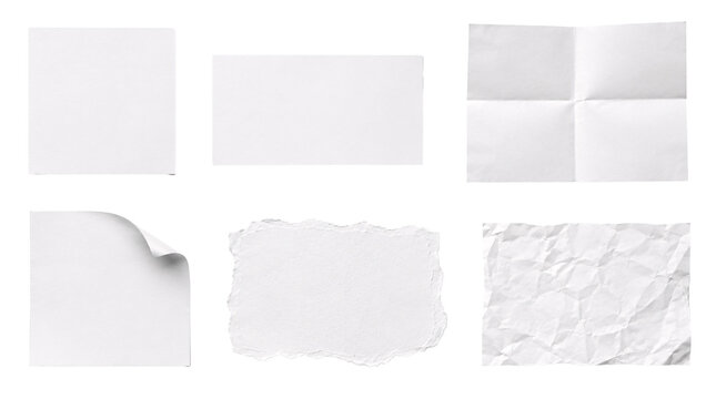 Assorted white paper sheets with folds and torn edge textures.