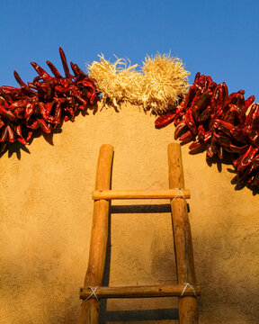 Christmas Ristras on Adobe Wall