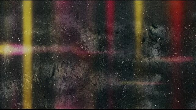 Abstract dark background with colorful vertical lens flare effects.