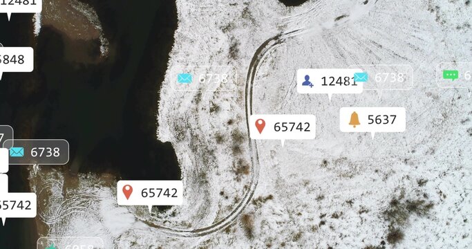 Overhead drone revealing S-curve tire tracks along shore, social media bubbles spreading over snow