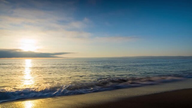 Black Sea and beach nearby against a sky with clouds and a dawn sun