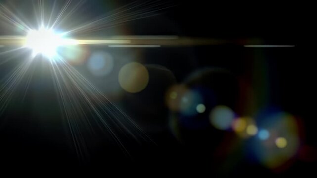 A bright lens flare emanates from the left side of the frame against a dark background.