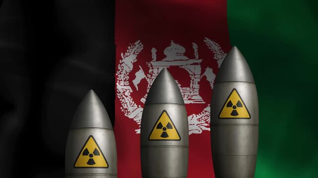 Nuclear missiles with radiation warning symbols against waving afghanistan flag background
