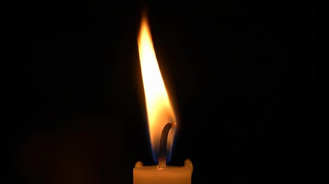 Close-up of burning candle flames, dancing candlelight flames