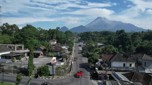 Majestic Merapi Volcano Peaks with Early Morning Clouds